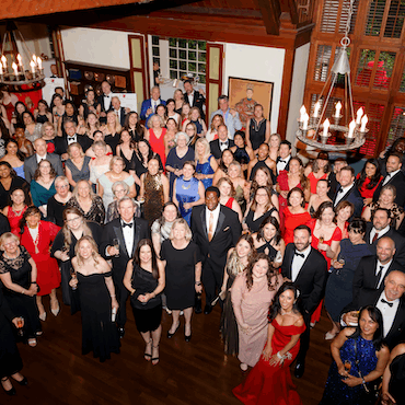 Overhead photo of a large group of members of the Junior League of Portland